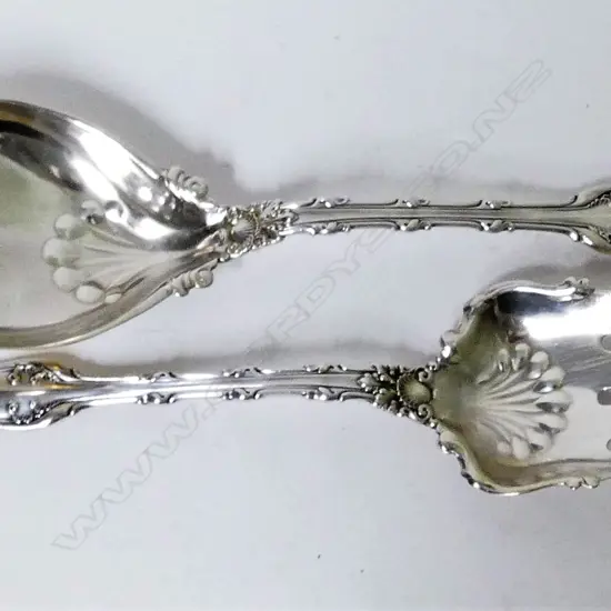 A pair of ornate American sterling silver servers