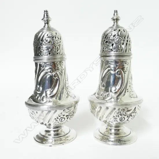 A pair of Victorian silver pepperettes