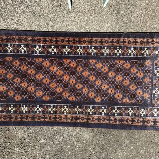 A hand knotted Baluchi rug