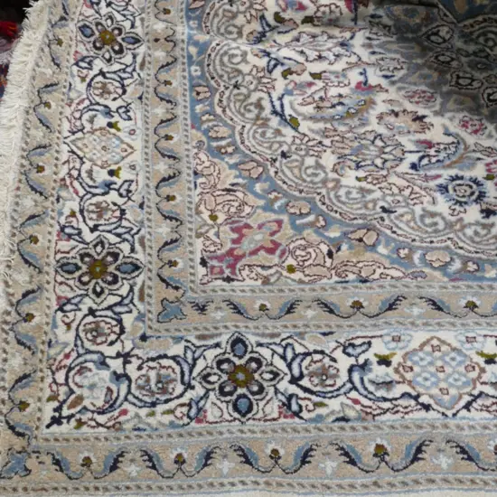 A large hand knotted Persian Nain rug
