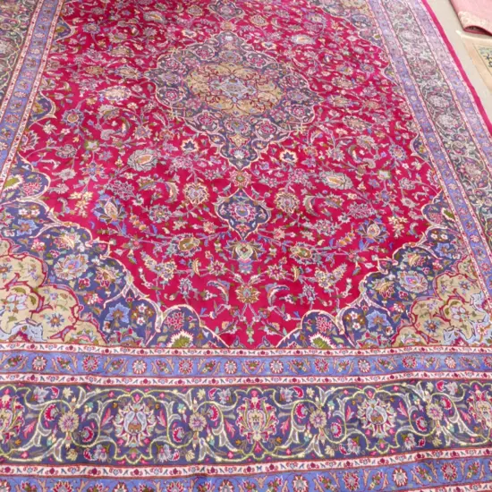 A large hand knotted Persian Meshed carpet
