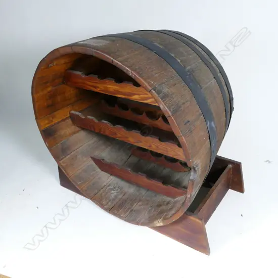 An oak wine barrel bottle storage shelf