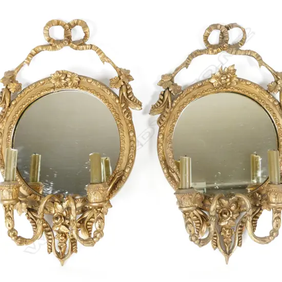 A pair of antique ornate plaster frame girandole mirrors