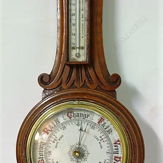 An Edwardian oak-cased banjo barometer