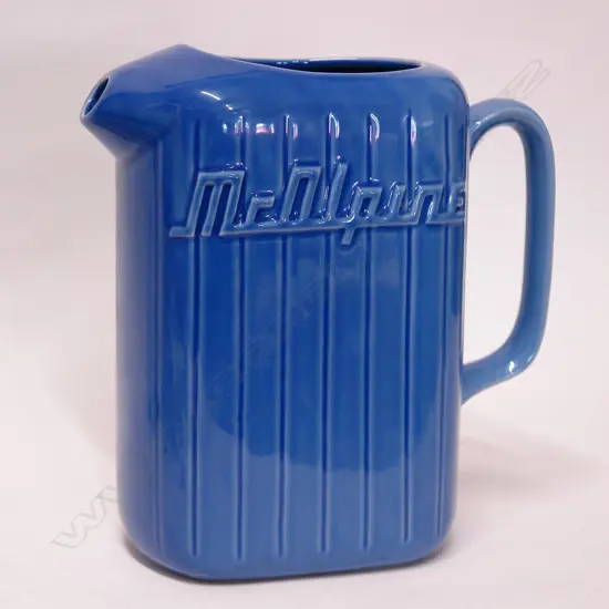 An uncommon Crown Lynn dark blue McAlpine refrigerator jug