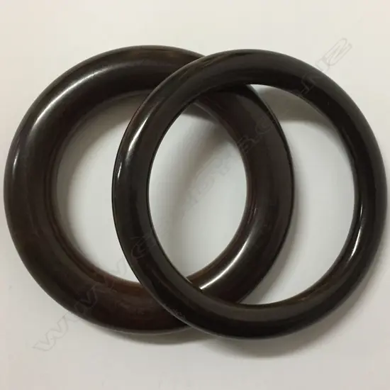 Two carved lignum vitae (from a bowling ball) bangles