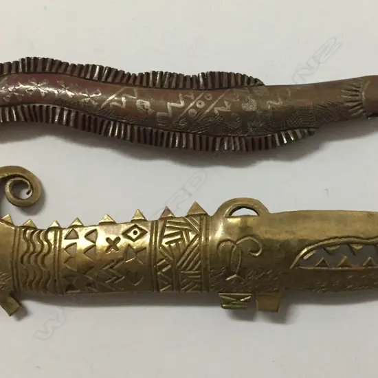 Peter McKay two metal brooches