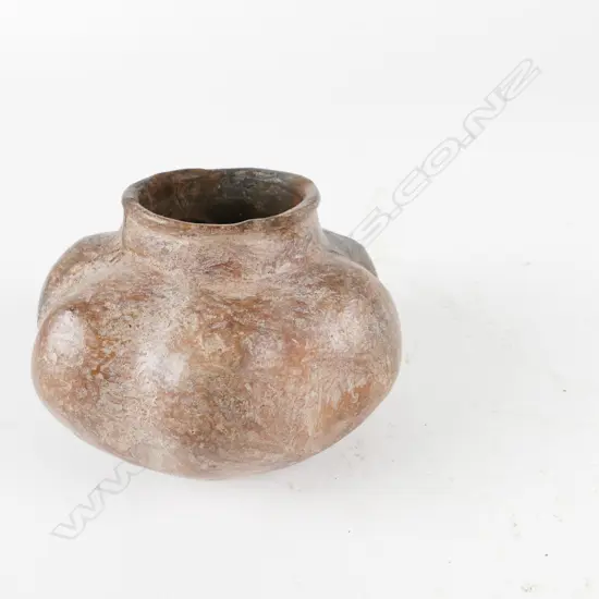 An antique Peruvian clay small pot