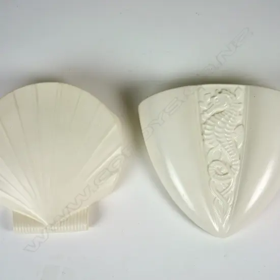 Two Crown Lynn white glazed wall pockets