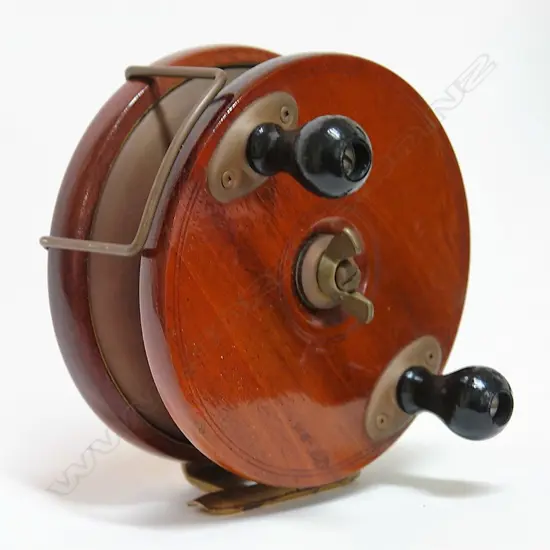 A Canadian Peetz  6" mahogany wood and brass game fishing reel