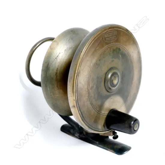 A solid brass side winder reel