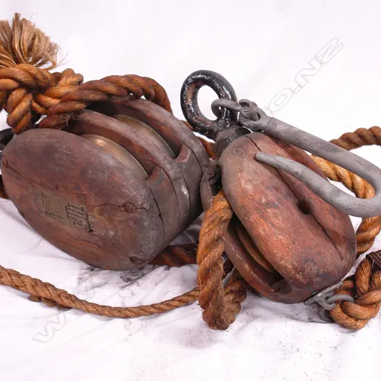 Two oak and brass ship's pulleys
