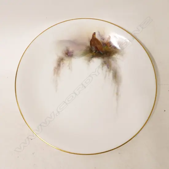 A Royal Worcester plate hand painted with game birds and signed Jas. Stinton