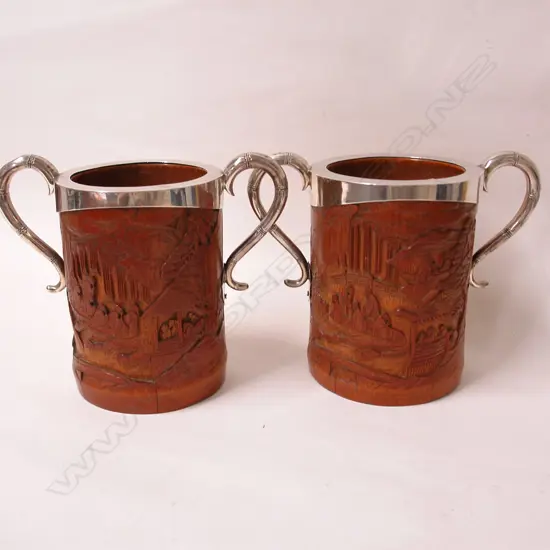 A pair of 19thC Chinese carved bamboo brush pots with English silver mounts