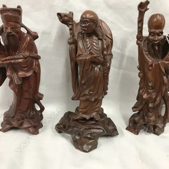 Three Chinese carved hardwood figures