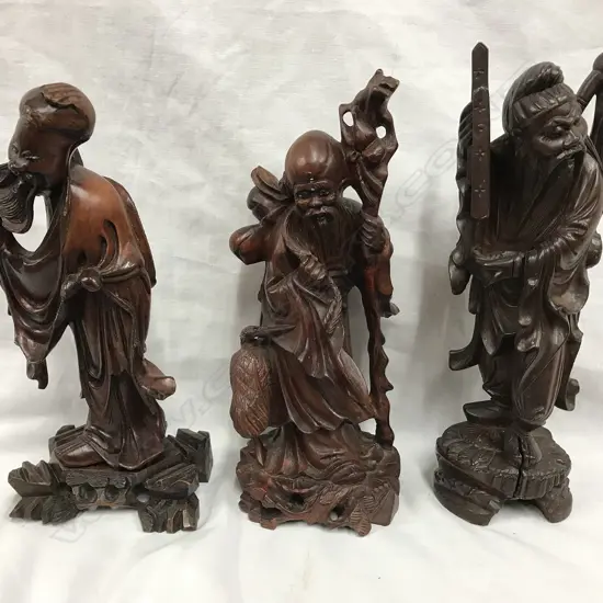 Three Chinese carved rosewood figures