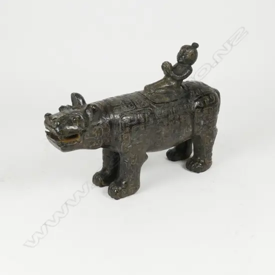 A sizable carved jade mythical beast and rider