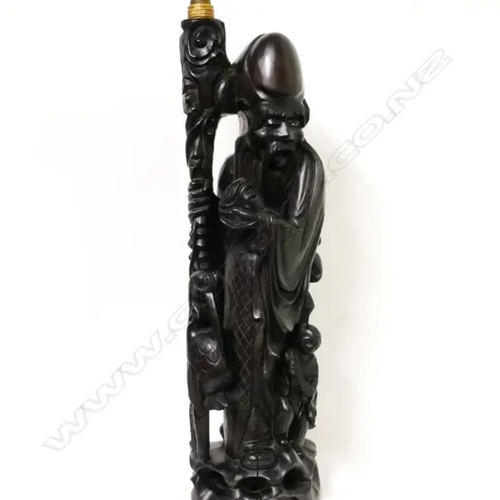 A Chinese carved blackwood table lamp base carved as Shao Lao