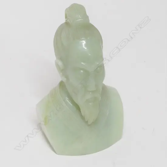 A carved pale jade portrait bust of a man