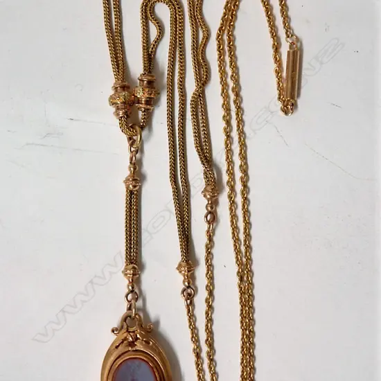 A Victorian 15ct. yellow gold double chain length with fob swivel pendant
