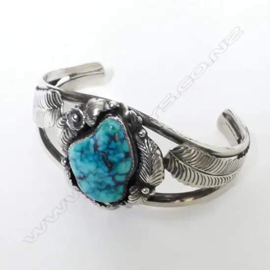 A Navajo silver and turquoise cuff