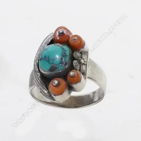 A Navajo silver coral and turqoise ring