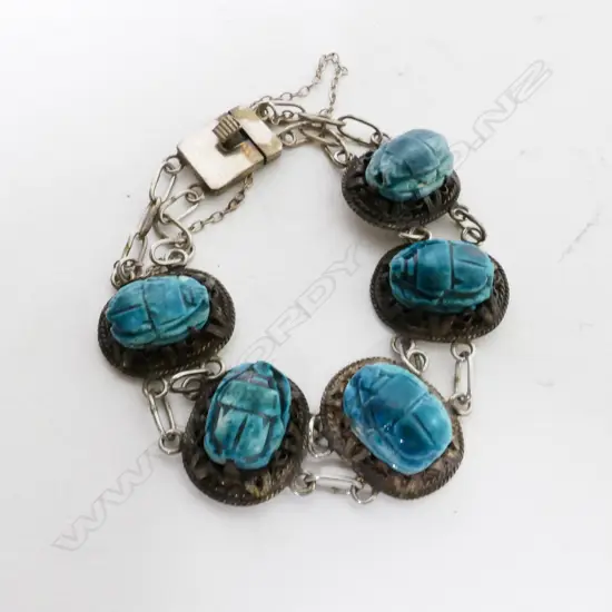 A silver and turquoise scarab bracelet