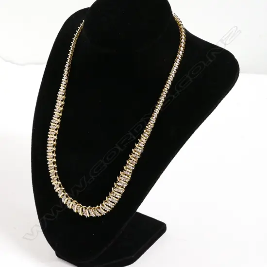 An 10ct. gold and diamond necklace