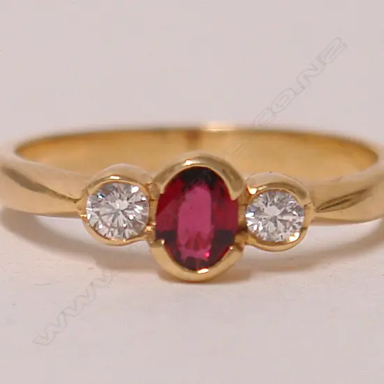 A modern lady's 18ct. yellow gold ruby and diamond dress ring