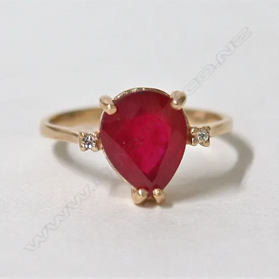 A modern lady's 9ct. yellow gold ruby and diamond dress ring