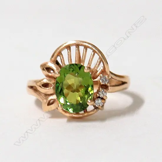 A lady's modern 9ct. gold and green topaz and diamond dress ring
