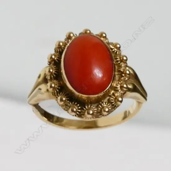 A 14ct. gold and coral ring
