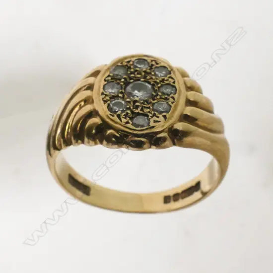 A gent's 9ct. gold and diamond ring