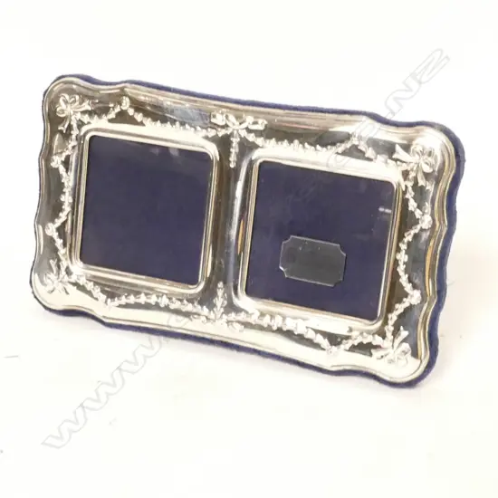 A modern silver double photo frame