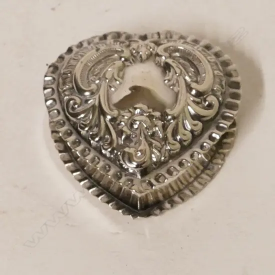 An Edwardian silver heart shaped pill box