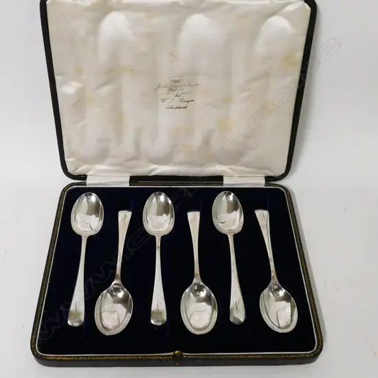 A set of silver dessert spoons