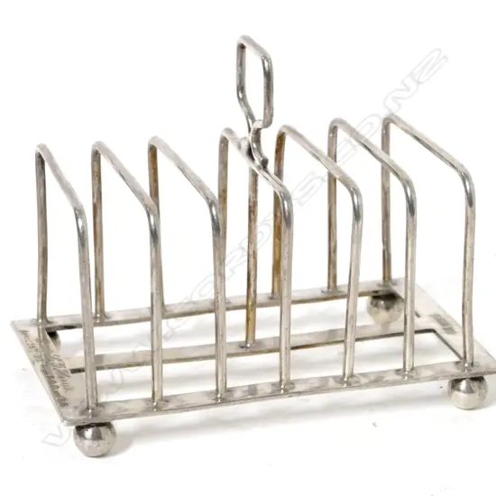 An Edwardian six-slice silver toast rack
