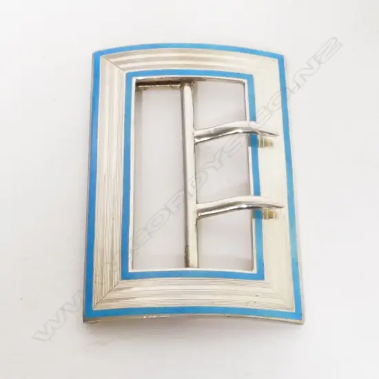 An early 1900s silver and enamel buckle