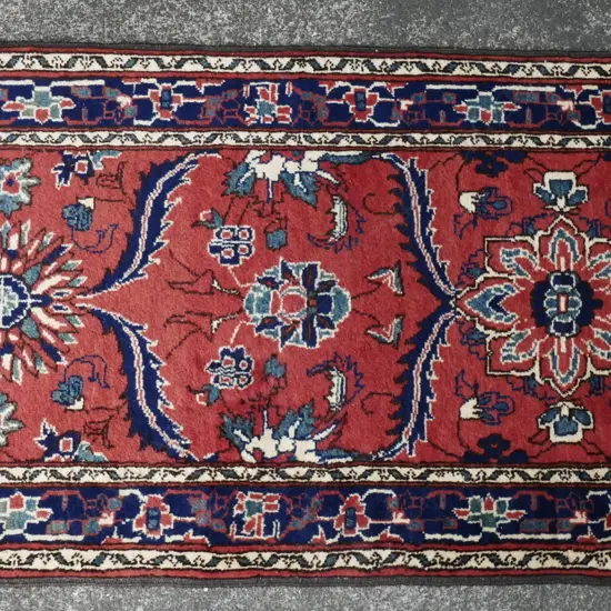 A hand knotted Persian runner