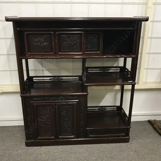 An Oriental figured rosewood display cabinet