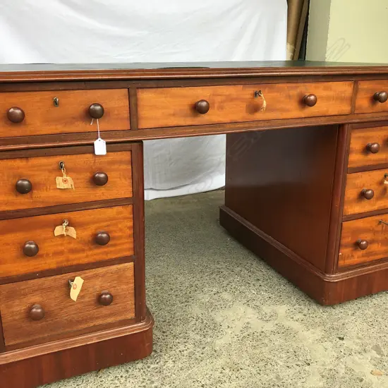 A Victorian mahogany pedestal knee hole desk