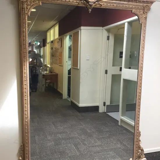 A large and impressive 19thC gilt overmantle mirror