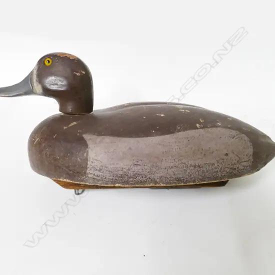 A vintage wooden Blue Bill duck decoy