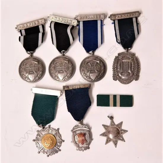 Seven silver band medallions awarded to R.L. Horsham