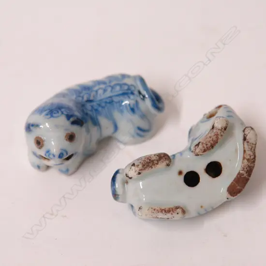 Two small old blue and white porcelain foo dogs