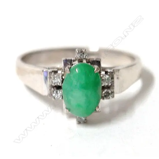 A lady's 18ct. white gold Chinese jade and diamond dress ring