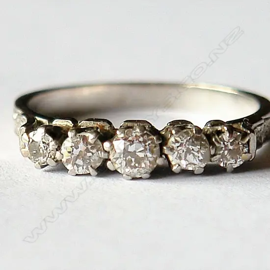 A lady's vintage 18ct. white gold and five stone diamond ring