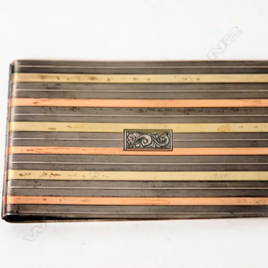 An Art Deco Cartier silver and 14ct/ bi-colour gold card case