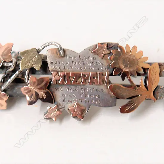 An early 20thC 'Mizpah' silver and gold brooch