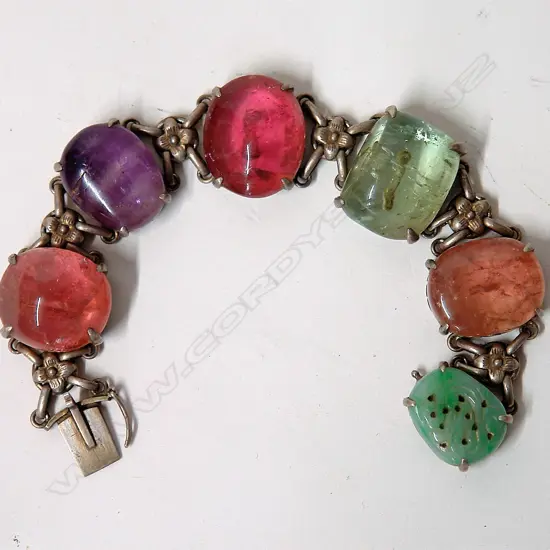 A vintage Chinese silver and large cabochon gemstone set bracelet